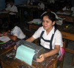 A girl using donated Braille writer in class at a school in Peru