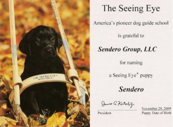 The Seeing Eye, American's Pioneer dog guide school is gratefule to Sendero Group for naming a Seeing Eye Puppy, Sendero, with picture of black lab puppy